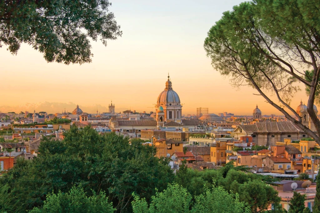 Breathtaking sunset view from Gianicolo Hill, overlooking Rome's stunning skyline and iconic landmarks.