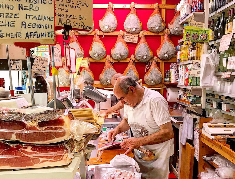 Colorful produce at Trionfale Market near the Vatican, offering a vibrant selection of meat.